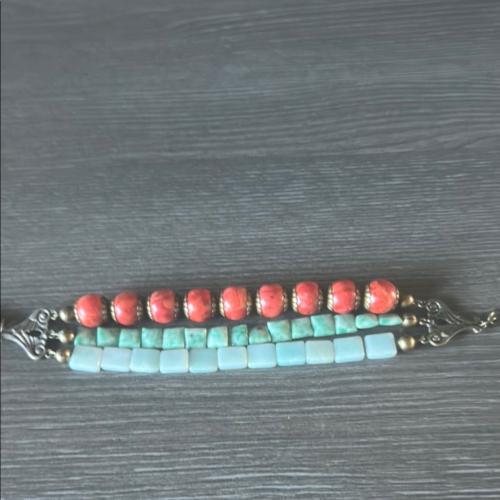 Vibrant Red and Blue Beaded Bracelet with Linear Design